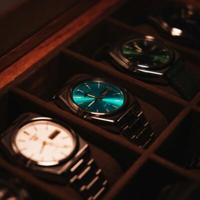 Showcase of elegant luxury watches in a display case with warm lighting.